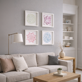Finished watercolor paper art from the DIY kit displayed in white frames on a modern living room wall