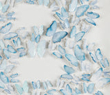 Close-up of hand-painted blue paper butterflies in the Blue Butterfly Letter B wall art