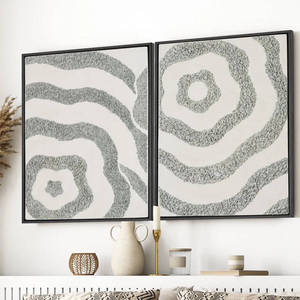 Framed textured abstract canvas set of 2 shown in a close interior view