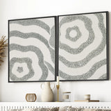 Framed textured abstract canvas set of 2 shown in a close interior view