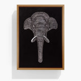 Textured elephant wall art in a natural wood frame on a black canvas background