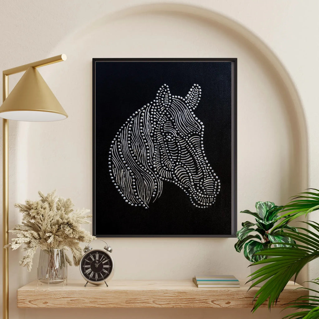 Textured horse wall art styled in a neutral interior with a black frame