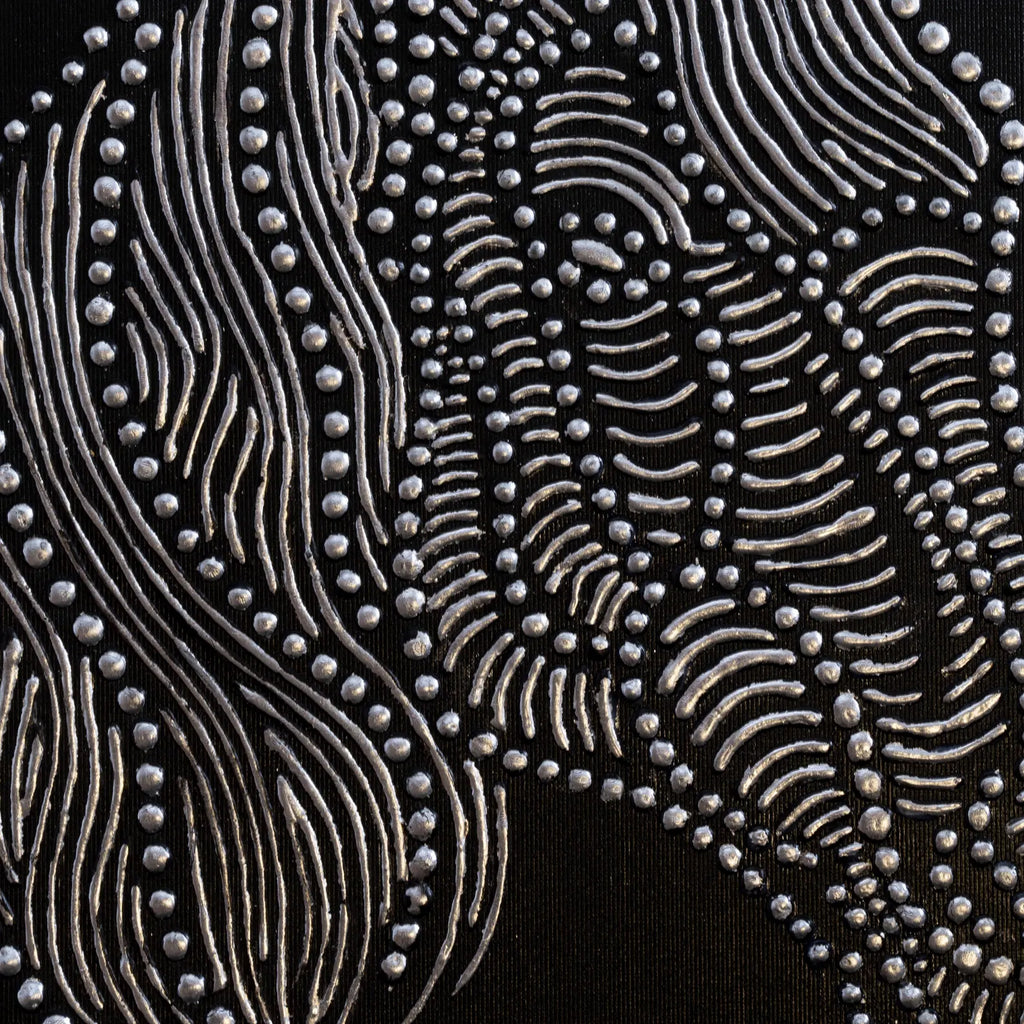 Close-up detail of textured horse relief canvas with metallic finish