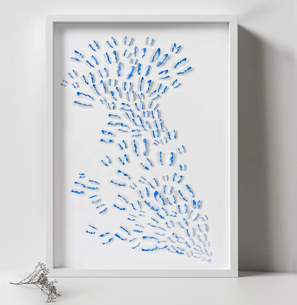 Blue Butterfly Wall Art in white frame showing the artwork up close in a minimal neutral setting
