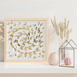 Gold Butterfly Spiral Wall Art displayed on a shelf with soft neutral decor