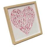 Angled view of Pink Butterfly Heart Wall Art showing the layered 3D paper butterfly composition