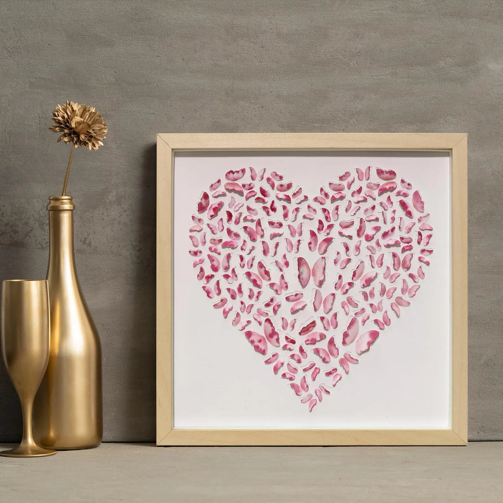 Pink Butterfly Heart Wall Art styled against a gray wall with elegant gold decor