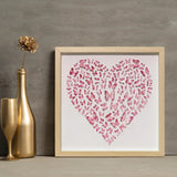 Pink Butterfly Heart Wall Art styled against a gray wall with elegant gold decor