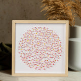 Angled view of Pink Daisy Circle Wall Art showing the layered 3D paper flower composition