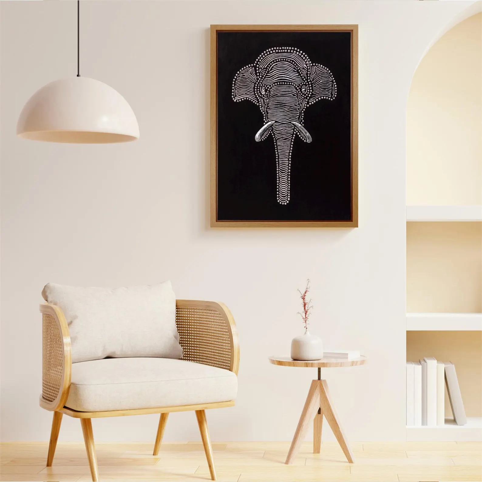 Textured elephant wall art displayed in a soft neutral room with a cream chair, pendant light and warm wooden accents.