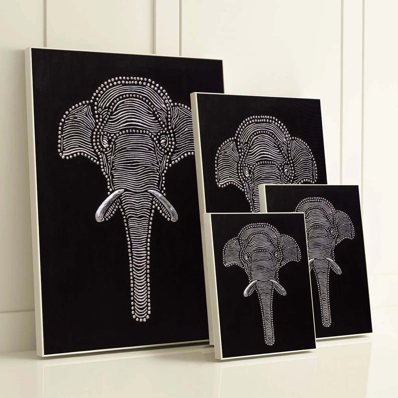 Textured elephant wall art shown in multiple canvas sizes to compare available size options for the design.