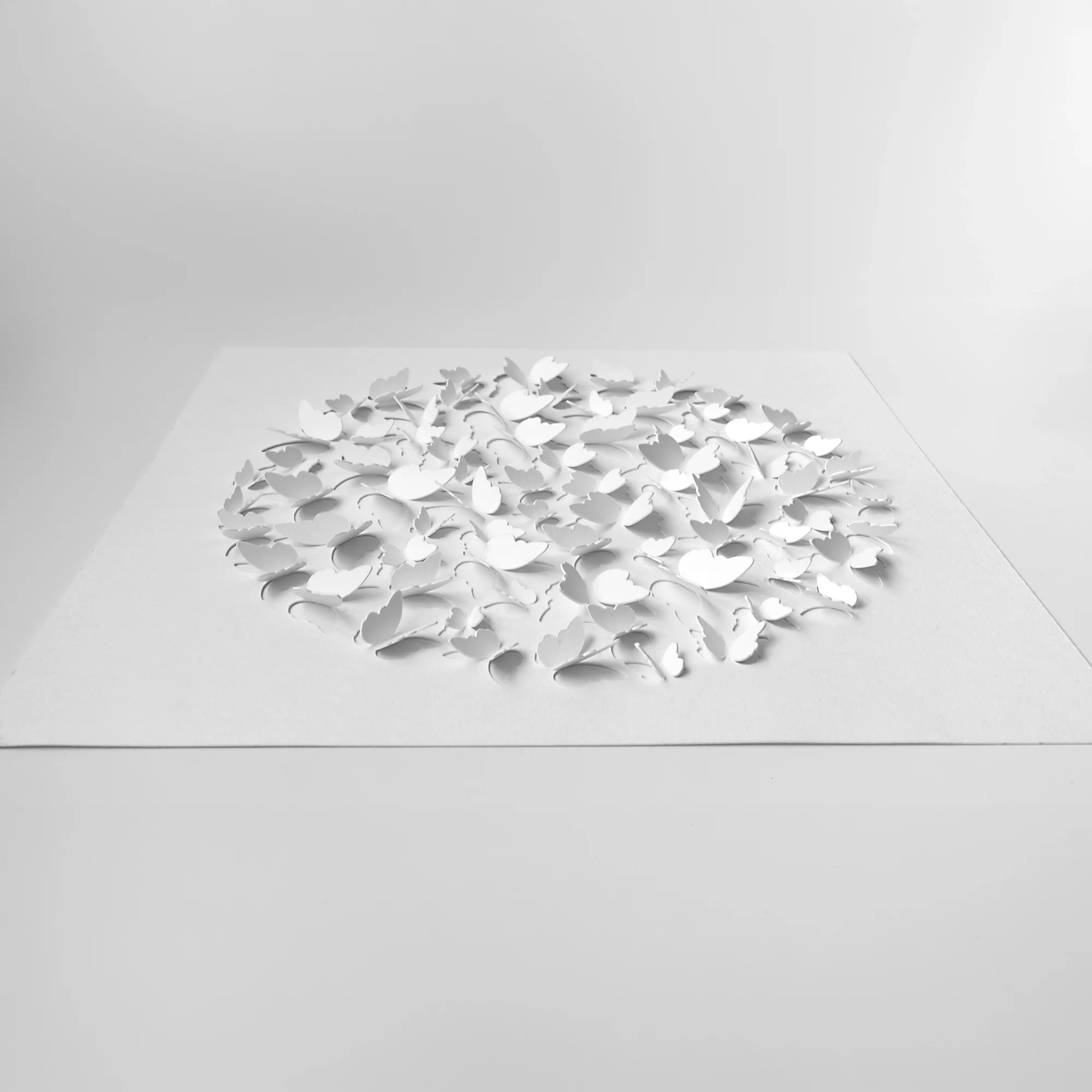 Side view of a white lotus 3D watercolor paper DIY kit showing the raised pre-cut paper layers.
